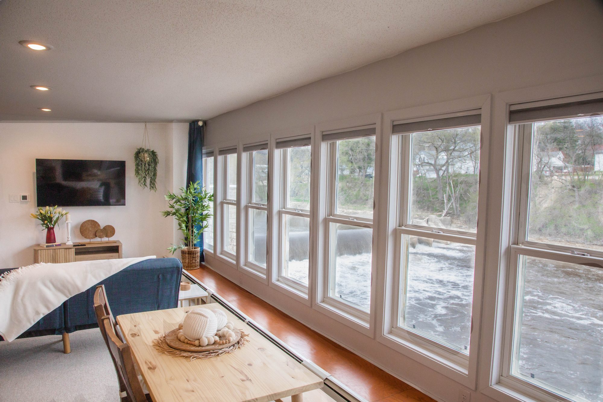 Suite A sunroom with a wall of windows